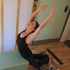 Martina practicing Pilates on the Reformer